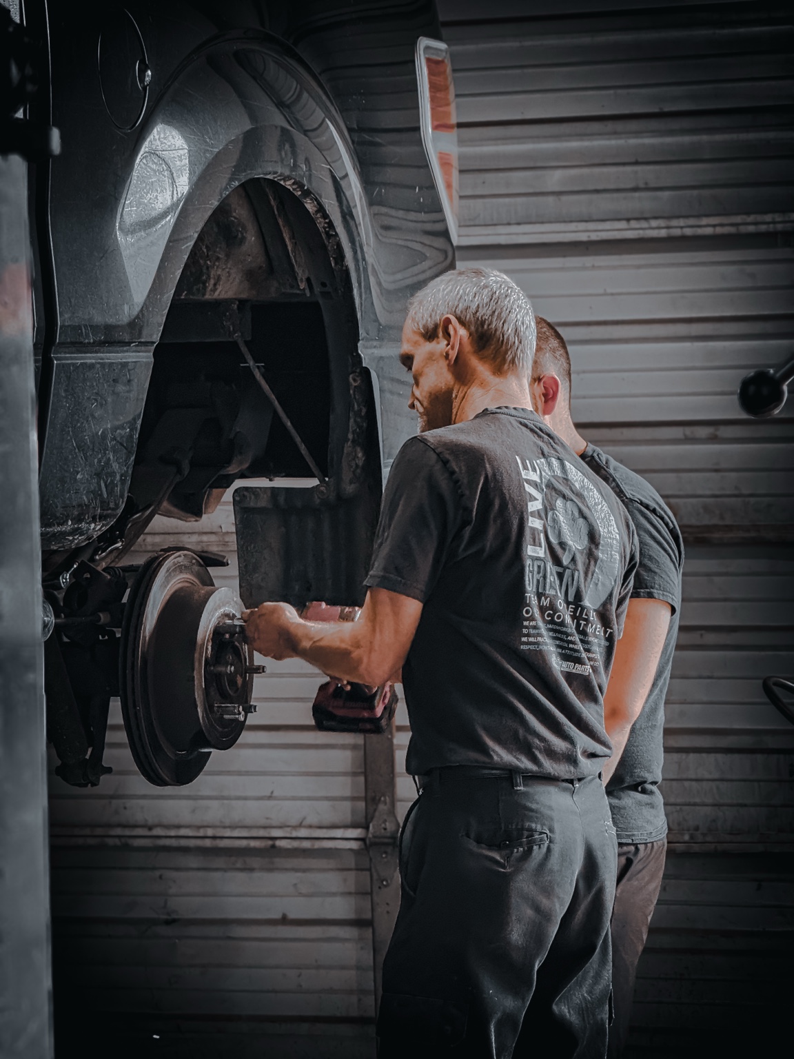 Dan working on a vehicle at the shop
